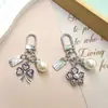 Nuevo de Moda Venta Caliente Transfronteriza Estilo Coreano Flor de Cinco Pétalos Niña Flor de Pera Colgante Llavero Accesorio Decoración para Bolsa Zouju