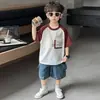 Ropa de Verano para Niños Conjunto de Camiseta de Manga Corta con Bolsa de Doble Capa 2026 Verano Nuevo Fresco Conjunto de Dos Piezas para Bebé Ropa de Moda