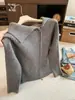 Jaqueta Cardigan de Tricô com Lapela e Zíper Duplo Feminina Outono/Inverno 2026 Novo Estilo Top de Tricô Reto Top Irregular