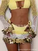 Conjunto de crochê artesanal de duas peças estilo europeu e americano para mulheres, top de proteção solar ombro a ombro com blocos de cor e saia curta justa com lantejoulas, conjunto para praia