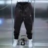 Coleção masculina de primavera da moda: calças casuais de cor sólida, calças jogger de novo estilo, calças slim fit elásticas e versáteis, pretas