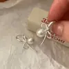 Nuevos Pendientes 2025 Estilo Japonés y Coreano Lazo Dulce Perla de Imitación Pendientes de Lujo Ligero Joyería de Moda Versátil Venta al por Mayor