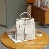 Transfronterizo 2025 nuevo modelo piel de oveja beige avena estilo universitario original retro simple bandolera casual bolso de hombro mochila