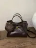 Bolsos de nicho súper populares transfronterizos para mujer 2026 nuevo estilo bolso cruzado tipo cubo bolso pequeño de alta gama exquisito para salir