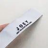 Suministro directo de fábrica de etiquetas tejidas de alta densidad para ropa, etiquetas de talla, marcas registradas, etiquetas de cuello, etiquetas tejidas con diseño personalizado, lavables