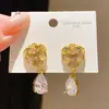 Pendientes de plata con aguja, súper brillantes, con flor de circón estilo Ins y colgante de gota de agua, pendientes de lujo ligero, exquisitos, de alta gama, para mujer