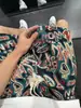 Shorts Masculino de Estilo Étnico Havaiano Verão Marca de Moda Americana Calças Esportivas Ins Largas Casuais Calças de Praia