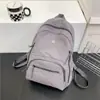 Mochila Nova da Moda de Cor Sólida, Versátil, Leve, Casual, Grande Capacidade, Bolsa Escolar Simples para Estudante Atacado