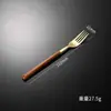 Vajilla de acero inoxidable transfronteriza Cuchillo y tenedor de imitación coreana con mango de madera Cuchara Vajilla occidental Vajilla con mango de clip de veta de madera Cuchara de postre al por mayor
