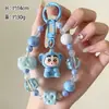 Llavero de cuentas de moda nuevo estilo pareja cadena para teléfono Ins colgante figura de resina accesorios pequeños suministro al por mayor