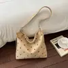 Bolso de lunares casual de gran capacidad transfronterizo para mujer, nuevo y elegante bolso de hombro y cruzado tipo tote casual para commuting 2026