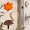 Topes de puerta de silicona con forma de hoja transfronterizos, instalación sin agujeros, diseño simple, silenciosos y amortiguadores, protector anticolisión