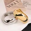 Pulsera personalizada de aleación irregular Pulsera transfronteriza europea y americana Pulsera de versión ancha de superficie brillante de lujo ligero con resorte