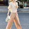 Conjunto de verano: un conjunto completo de tops de manga corta y pantalones de pierna ancha 2026, un estilo relajado y casual, un traje atractivo para mujer