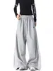 Calça de moletom retrô estilo americano em blocos de cores listradas, unissex, para o outono, com caimento relaxado, pernas largas e design até o chão