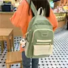 26 modelos nuevos de mochilas ligeras de gran capacidad para estudiantes de secundaria, versión coreana de mochilas para chicas dulces en colores Morandi