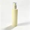Botella de vidrio beige de hombro plano, botella de spray vacía de 100 ml, botella de loción de agua de esencia, en stock para venta al por mayor, entrega rápida de muestras