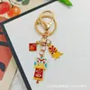Llavero Colgante Año Nuevo 2026 Metal Zodiaco León Dorado Petardo Despertar Bolsa de la Fortuna Colgante Evento Pequeño Regalo
