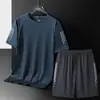 2215 Conjunto Estilo Nueva Pareja Transpirable Seda de Hielo Camiseta de Manga Corta para Hombre Venta al por Mayor Casual Tallas Grandes Unisex Conjunto Venta Caliente
