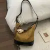 Bolsa Casual Retro de Camurça para Mulheres 2025 Novo Estilo Roupas de Trabalho Versátil Bolsa Transversal Moda Única Ombro Axila Bolsa Saco