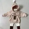 INS outono e inverno veludo dupla face bebê espessado fofo Natal Ano Novo suéter com capuz bebê masculino e feminino urso longo