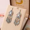 Pendientes creativos cortos estilo chino Pendientes de joyería de margarita pendientes de flores y hojas pendientes suministro entidad venta al por mayor