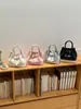Bolso de Mano con Colgante Estilo Coreano para Mujer 2026 Nuevo Versátil Bolso de Hombro Cruzado de PU Bolso Cubo Simple de Moda