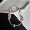 Nova alça de telefone de tubo curvo com contas, estilo ins da moda, acessório versátil e estiloso para bolsas de câmera e bolsas de mão