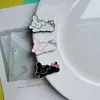 Lazo de Dibujos Animados Perro Blanco y Negro Accesorios Pequeños Zuecos DIY Funda de Teléfono Juguete Accesorios para Pasador de Pelo Decoración Parches