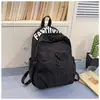 Mochila escolar ligera e impermeable de nicho para estudiantes de preparatoria, unisex, mochila deportiva para exteriores de gran capacidad, mochila de viaje al por mayor