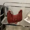 Design Laço Francês 2025 Padrão Tecido Nova Moda Elegante Personalidade Fashionável Bolsa de Ombro Único Bolsa de Axila para Mulheres