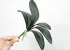 Sensação de mão em PU Simulação de folha de Phalaenopsis Arranjo de flores de Phalaenopsis e folhas Decoração de flores para mesa de jantar Decoração de sala de estar Planta
