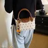 Bolso bandolera versátil de un solo hombro, bolso cuadrado pequeño retro súper popular, bolso cruzado de lunares de nicho, nuevo bolso de almacenamiento estilo coreano ins2026