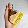Nuevo Llavero de Mini Piano Transfronterizo Dibujo Animado Lindo Tocando el Piano Sanrio Juguete Musical Colgante Pequeño