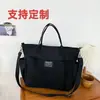 Estilo ins japonés bolsa de mano versátil simple para el trabajo lona bolso para estudiante universitario mochila de un solo hombro bolso cruzado para hombres y mujeres