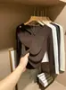 Camiseta de manga larga acanalada, sexy y con diseño calado, un top de moda para mujer, se puede usar como capa interior o exterior, adecuada para primavera, otoño e invierno.