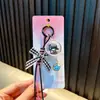 Lindo Colgante de Llavero Carrillón de Viento de Gato 3D con Lazo, Decoración para Bolso, Regalo Pequeño para Niñas, Venta al por Mayor