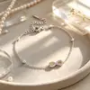 Pulsera Cruz Acero Inoxidable Infinito 8 Circonita Venta al por Mayor para Mujer Lujo Ligero Sensación de Alta Gama Resistente al Desgaste Acero de Titanio Joyería de Mano