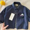 Camisa jeans infantil de manga longa transfronteiriça, coleção outono 2026, peça externa com bolsos, camisa de bebê estilo coreano, tecido grau A