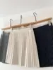 Falda plisada de punto gris estilo universitario para mujer petite, falda corta de línea A, nueva falda de medio cuerpo versátil de cintura alta para otoño e invierno