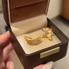 Alambre de plata de ley s925 proceso de trefilado diamante de alto carbono flor de mariposa AB aretes asimétricos moda combinan con todo alta gama lujo ligero