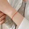Pulsera trenzada de cordón rojo de plata S925 de alta gama, estilo chino nuevo, para mujer, nueva tendencia nacional de nicho, accesorio de mano con cadena lateral del año zodiacal