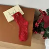 Calcetines Rojos Nuevos para Mujer de Otoño e Invierno con Lazo y Diseño Floral, Calcetines de Media Pantorrilla para Mujer, Calcetines Holgados Estilo Ins al por Mayor