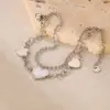 OPK Pulsera de Acero Inoxidable Moda INS Europea y Americana Diseño de Doble Capa Corazón de Concha Blanca Pulsera Sencilla Versátil de Acero de Titanio para Mujer