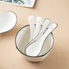 Cuchara de Hueso Blanco Puro Porcelana Venta al por Mayor Línea Negra Mango Largo Cabeza Grande Cuchara para Sopa Cuchara para Lonchera Hogar Restaurante Hotel Vajilla Comercial