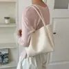 Bolsa 2026 Versátil Simple de un Hombro para el Trabajo Tejido Suave Tipo Pan Super Caliente Cubo Gran Capacidad Bolso Nuevo para Mujer de Mano
