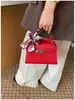 2026 Verão Nova Bolsa Estilo Coreano Texturizada Bolsa Kelly Simples para o Dia a Dia Feminina Bolsa Transversal de Ombro Feminina