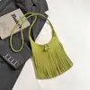 Bolso de hombro personalizado estilo coreano para mujer, nuevo modelo de verano 2026, bolso de mano y bolso de axila de gran capacidad con borlas, moderno y a la moda