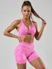 Nuevo conjunto de yoga europeo y americano con estampado de leopardo, con sujetador deportivo de color contrastante, shorts de cintura alta para levantar glúteos y apretar el abdomen, ropa de fitness