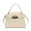 Bolso Kelly de Mano Transfronterizo Coreano para Mujer 2025 Nuevo de Moda Tendencia Bolso Cuadrado Pequeño Versátil Bolso de Hombro Cruzado para Viaje